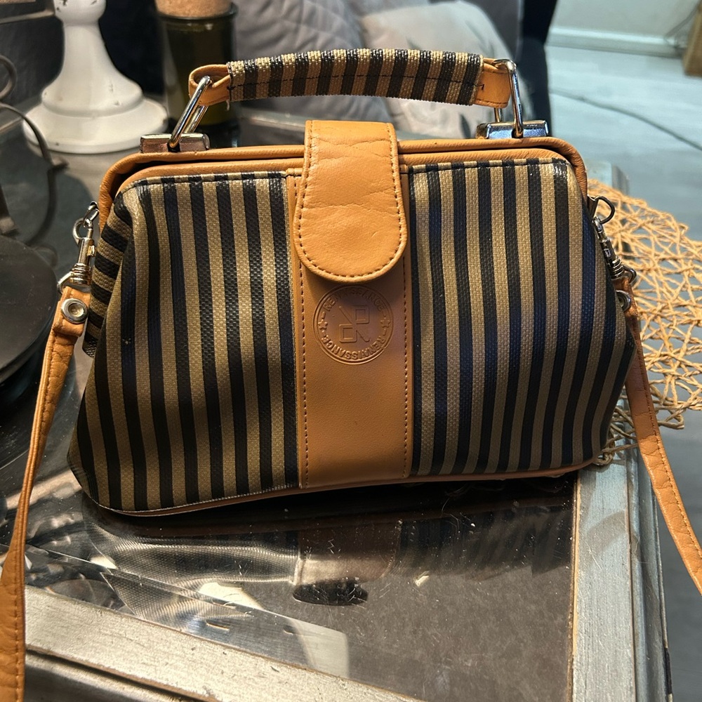 Renaissance striped purse with leather accents double closure and textured back